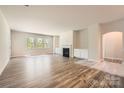 Bright and airy living room featuring hardwood floors and a cozy fireplace at 1578 Croydon St, Indian Land, SC 29707