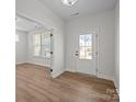 Bright entryway with hardwood floors and a view into an adjacent room at 622 Amberjack Pl, York, SC 29745