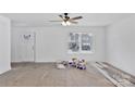 Bright living room with new flooring and ceiling fan at 624 W Kerr St, Salisbury, NC 28144