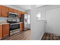 Kitchen with stainless steel appliances and wood cabinets at 13660 Meade Glen Ct, Charlotte, NC 28273