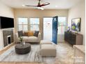 Bright living room featuring a comfy sofa and a fireplace at 123 Oak St, Chester, SC 29706