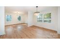 Bright dining room with hardwood floors and chandelier at 129 Doster Rd, Lancaster, SC 29720