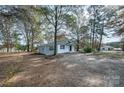 Ranch-style home on a large lot with mature trees at 129 Doster Rd, Lancaster, SC 29720