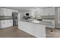 Modern kitchen with white cabinets and granite countertops at 2029 Big Dipper Dr, Clover, SC 29710