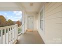Charming front porch offers natural light and views of the surrounding landscape at 8931 Meadow Vista Rd, Charlotte, NC 28213