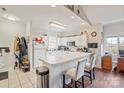 Well-lit kitchen featuring white cabinetry, modern appliances, and a convenient breakfast bar at 8931 Meadow Vista Rd, Charlotte, NC 28213