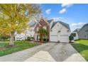 Two-story house with a large driveway and mature tree at 124 Harris Farm Rd, Mooresville, NC 28115