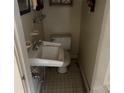 Small bathroom with a toilet and sink at 614 Morven Rd, Wadesboro, NC 28170