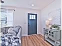 Bright entryway with dark door and console table at 816 Wellwood Ave, Statesville, NC 28677