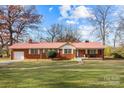 Brick ranch home with a metal roof and spacious yard at 955 Goodnight Rd, Salisbury, NC 28147