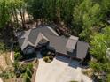 Overhead shot of a beautiful home with lush landscaping, a spacious driveway, and a three-car garage at 1140 Inlet Pointe Rd, Salisbury, NC 28146
