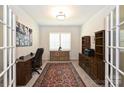 Home office with built-in shelving, hardwood floors and large window with plantation shutters at 2353 Abundance Ln, Waxhaw, NC 28173