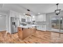 Modern kitchen featuring white cabinets, stainless steel appliances, and a copper island at 190 Williamson St, Troy, NC 27371