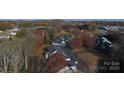 Aerial view showing condo complex with mature trees and fall colors at 194 E Jay Dr # 3, Taylorsville, NC 28681