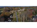 Aerial view showcasing a well-kept neighborhood and tree-lined street at 194 E Jay Dr # 3, Taylorsville, NC 28681