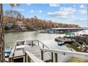 Picturesque waterfront view with docks and boat slips on a serene lake at 26022 Misty Way Dr, Tega Cay, SC 29708