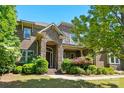 Lovely brick and stone home with a welcoming front entrance and beautifully maintained landscaping at 16515 Governors Club Ct, Charlotte, NC 28278