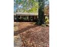 Quaint home featuring a yard covered with fallen leaves, adding a touch of seasonal charm at 116 Lodge Hall Ct, Stony Point, NC 28678