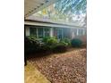 Cozy brick home with well-maintained landscaping, offering a peaceful and inviting atmosphere at 116 Lodge Hall Ct, Stony Point, NC 28678