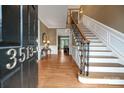 Inviting foyer with hardwood floors, a staircase with wood and iron railings, and elegant details at 3513 Country Club Dr, Gastonia, NC 28056