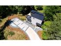 Aerial view of modern home, showcasing the roof, balcony and driveway at 6534 Providence Rd, Charlotte, NC 28226