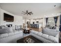 Open living space with kitchen views, hardwood floors, and a fireplace at 4015 Havenport Cir, Tega Cay, SC 29708