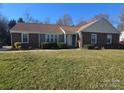 Charming single-story brick home with well-maintained front yard and mature landscaping at 433 Pamela St, Gastonia, NC 28054