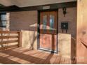 Brick ranch home with a wooden deck and stairs at 5315 Ruth Dr, Charlotte, NC 28215