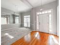Bright dining room features hardwood floors, neutral walls, and a stylish light fixture at 5839 Painted Fern Ct, Charlotte, NC 28269