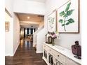 Inviting entryway with elegant decor and wood floors, leading to the living spaces at 7669 Tanglewood Way, Denver, NC 28037