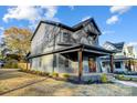 Charming two-story home with craftsman-style details and a covered front porch at 901 Edgemont Ave, Belmont, NC 28012