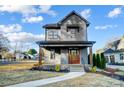 Inviting two-story home with a covered front porch and well-maintained landscaping at 901 Edgemont Ave, Belmont, NC 28012