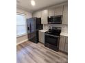 Well-equipped kitchen boasts modern appliances and ample counter space at 1826 Birch Heights Ct, Charlotte, NC 28213