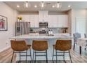 Modern kitchen with white cabinets, granite island, and stainless steel appliances at 2123 Belterra Dr, Charlotte, NC 28216