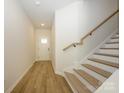 Bright entryway with hardwood flooring, staircase, and natural light from the front door at 161 Halite Ln, Waxhaw, NC 28173