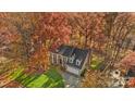 Aerial view of a house nestled in a wooded area at 416 Sabot Ln, Matthews, NC 28105