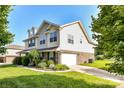 This lovely home features an attached garage, well-maintained landscaping, and a classic design at 7534 April Mist Trl, Huntersville, NC 28078