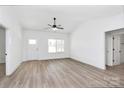 Sunlit living room showcasing modern design, neutral tones, and smooth flooring, transitioning to other rooms at 872 Old Mocksville Rd # 1, Statesville, NC 28625