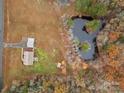 A breathtaking aerial view of a serene property with a lush pond at 170 Stillwater Rd, Richfield, NC 28137