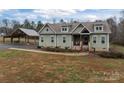 Charming craftsman-style home with inviting front porch and lush, landscaped yard at 170 Stillwater Rd, Richfield, NC 28137