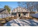 Newly built house with tan siding, black door, and a spacious yard at 511 E Sycamore St, Lincolnton, NC 28092