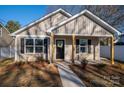 Charming house with a front porch and well-manicured lawn at 511 E Sycamore St, Lincolnton, NC 28092