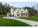 Charming two-story home featuring a two car garage and a well-manicured front yard at 1875 Rock Hill Church Rd # 4, Matthews, NC 28104