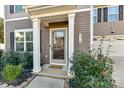 Inviting front entrance with a covered porch and landscaping at 3218 Bouquet St, Charlotte, NC 28215