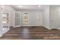 Bright living room with hardwood floors and French doors at 4408 Shea Ln, Mint Hill, NC 28227