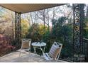 Private balcony overlooking a wooded area, perfect for relaxing at 4754 Hedgemore Dr # S, Charlotte, NC 28209