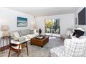 Spacious living area featuring hardwood floors, patio access, and ample natural light at 4754 Hedgemore Dr # S, Charlotte, NC 28209