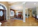 Formal dining room featuring hardwood floors, chandelier, and large windows at 1038 Rolling Park Ln, Fort Mill, SC 29715