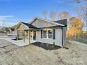 New construction home with gray siding and walkway at 1308 Carmel Rd, Lancaster, SC 29720