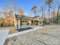 Newly built home with gray siding and a front porch at 1308 Carmel Rd, Lancaster, SC 29720